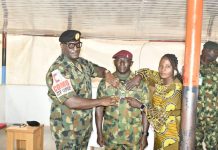 Commander Joint Task Force Operation Enduring Peace Decorates Newly Promoted Soldiers