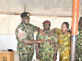 Commander Joint Task Force Operation Enduring Peace Decorates Newly Promoted Soldiers