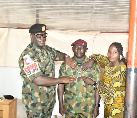 Commander Joint Task Force Operation Enduring Peace Decorates Newly Promoted Soldiers