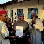 Prof. Chris Kwaja Receives APC Membership Card